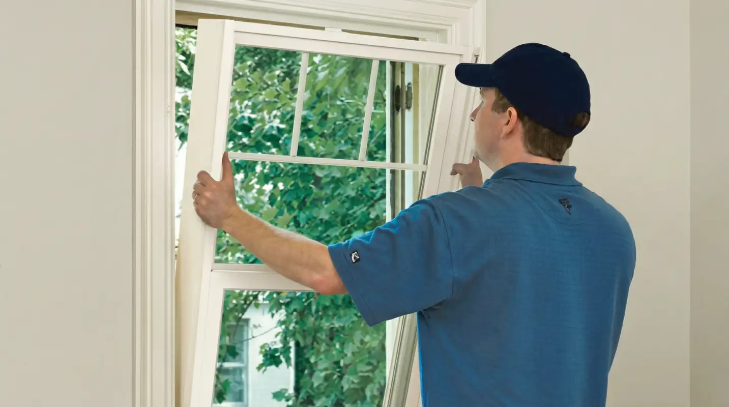 Professional contractors performing a residential window insulation and replacement service in Pasadena, CA